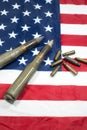 American flag with bullets, shells, cartridges and projectiles on it. Lend-Lease concept.  Army concept. Sales of weapons and Royalty Free Stock Photo