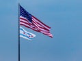 American flag and Chicago flag on blue sky background. Patriotism, Pride, Honor