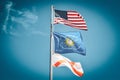 American Flag, Conch Republic Flag and the State of Florida flag against a blue sky