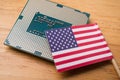 American flag on CPU computer (central processing unit) wooden background. Royalty Free Stock Photo