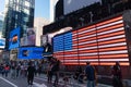 American Flag among Crowds of People in Times Square Celebrating after the Win of President Elect Joe Biden Royalty Free Stock Photo