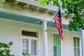 American Flag Displayed on Column of Historic Home