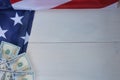 American flag, dollars on white wooden background.Copy space for text Royalty Free Stock Photo