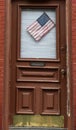 American flag on a door of the house in New York, USA Royalty Free Stock Photo