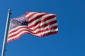 American flag on pole flapping on the wind Royalty Free Stock Photo