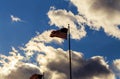 American flag flagpole waving in the wind against clouds, blue sky Royalty Free Stock Photo