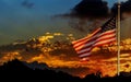 American flag on flagpole waving in the wind American flag in front of bright sky Royalty Free Stock Photo