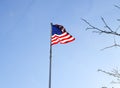American flag flying and billowing in the wind Royalty Free Stock Photo