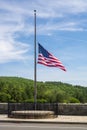 American flag at half staff blowing in the breeze Royalty Free Stock Photo