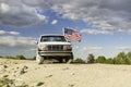 American flag flying on an old Ford truck Royalty Free Stock Photo