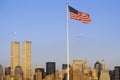 American Flag flying over skyline of New York City from New York Harbor, NY Royalty Free Stock Photo