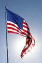 The American Flag flying proudly in a clear blue sky Royalty Free Stock Photo