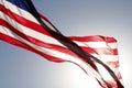 The American Flag flying proudly in a clear blue sky Royalty Free Stock Photo