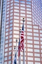 American flag in front of a skyscraper. Royalty Free Stock Photo