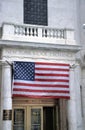 American flag in front of the New York Stock Exchange Royalty Free Stock Photo