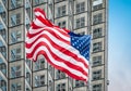 American flag in front of skyscraper. Royalty Free Stock Photo