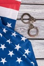 American flag and handcuffs, top view. Royalty Free Stock Photo