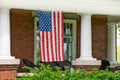 American flag hanging on front porch