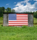 American Flag Hanging on an Old Barn Royalty Free Stock Photo