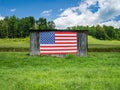 American Flag Hanging on an Old Barn Royalty Free Stock Photo