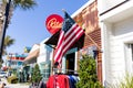 American flag hanging outside a restaurant with corrugated metal walls