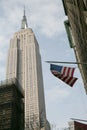 The American flag hanging over the Empire State Building, Manhattan, New York