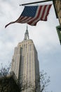 The American flag hanging over the Empire State Building, Manhattan, New York