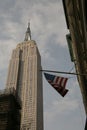 The American flag hanging over the Empire State Building, Manhattan, New York