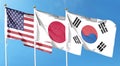 American flag with Japan flag and South Korea flag on cloudy sky. waving in the sky Royalty Free Stock Photo