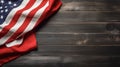 An American Flag Lying on an aged, weathered rustic wooden Backg Royalty Free Stock Photo