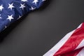 American flag lying on black grainy background Royalty Free Stock Photo