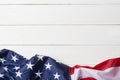 American flag lying on old white wooden background Royalty Free Stock Photo