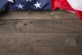 American flag lying on old wooden background Royalty Free Stock Photo