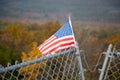 American Flag on Mountain Top and Foliage