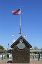 American flag and nautical flags flying at Woodcleft Esplanade in Freeport, Long Island