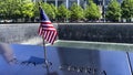 American flag over the names of the victims who died in the terrorist attack on the Twin Towers.