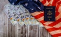 American flag and passports with the symbols of the United States of America and USA currency hundred US dollar bills Royalty Free Stock Photo