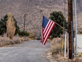 American flag on a flag pole on display during Veterans Day. Royalty Free Stock Photo