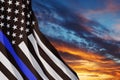 American flag with police support symbol Thin blue line on sunset sky. Royalty Free Stock Photo