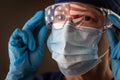 Female Medical Worker Wearing Goggles, Protective Face Mask Reflecting American Flag Royalty Free Stock Photo