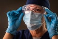 American Flag Reflecting on Female Medical Worker Wearing Protective Face Mask and Goggles Royalty Free Stock Photo