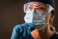 American Flag Reflecting on Female Medical Worker Wearing Protective Face Mask and Goggles Royalty Free Stock Photo