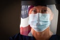 American Flag Reflecting on Female Medical Worker Wearing Protective Face Mask and Shield Royalty Free Stock Photo