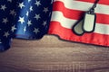 American flag and soldiers badges on wooden background. Royalty Free Stock Photo