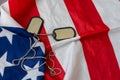 American flag and soldiers tags on background. Veterans Day Concept. Royalty Free Stock Photo