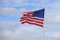 american flag with stars and red and white stripes on blue sky Royalty Free Stock Photo