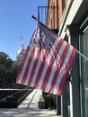 An American flag on a sunny day in front of the Savannah City Hall - GEORGIA Royalty Free Stock Photo