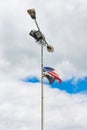 American flag tied to an old lamp post Royalty Free Stock Photo