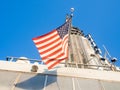 American flag on top of the Empire State Building in New York Royalty Free Stock Photo