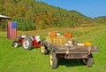 American flag, tractor and trailer with hay bales and pumpkins at Vermont farm Royalty Free Stock Photo